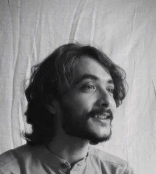 Rushabh Ahir singing a devotional Gujarati song with his eyes closed