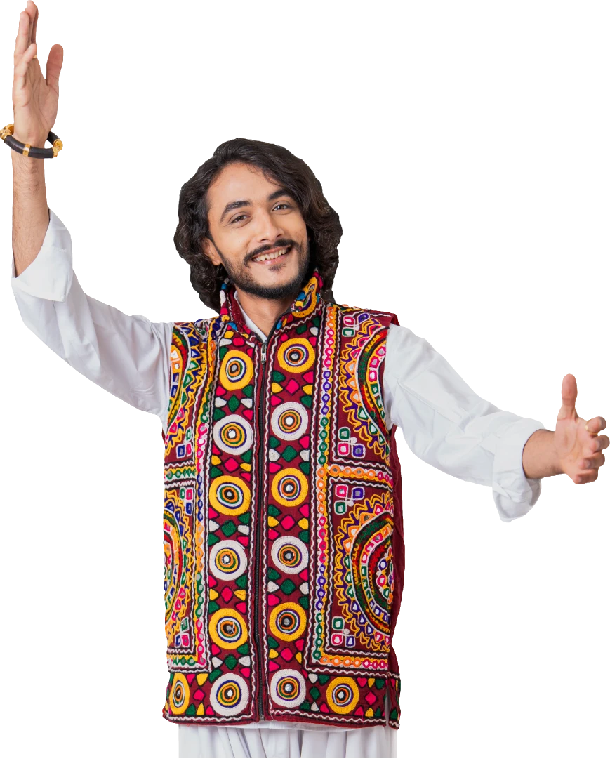 Rushabh Ahir dancing garba in a colourful mirror-work kediyu, arms open